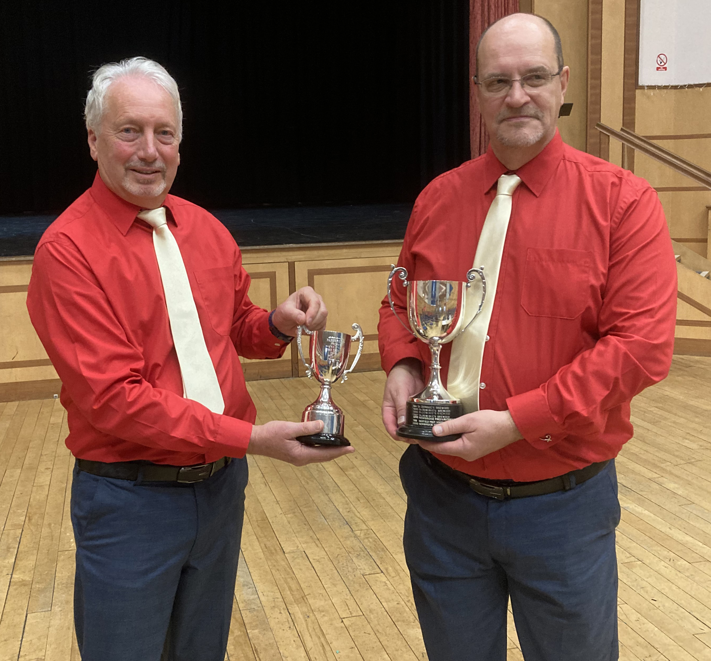 1) Chorus chairman Chris Franey(left)  with the Best Barbershop Chorus Trophy and Musical Director Mike Gearey with the Eva Preece Cup.